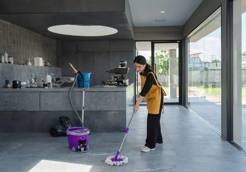 female-employee-cleaning-modern-coffee-shop-interi-2025-01-16-13-28-01-utc-scaled-ra0nyi4161f3203p7uyu39gmtipiu50ge9ruz3s1g8